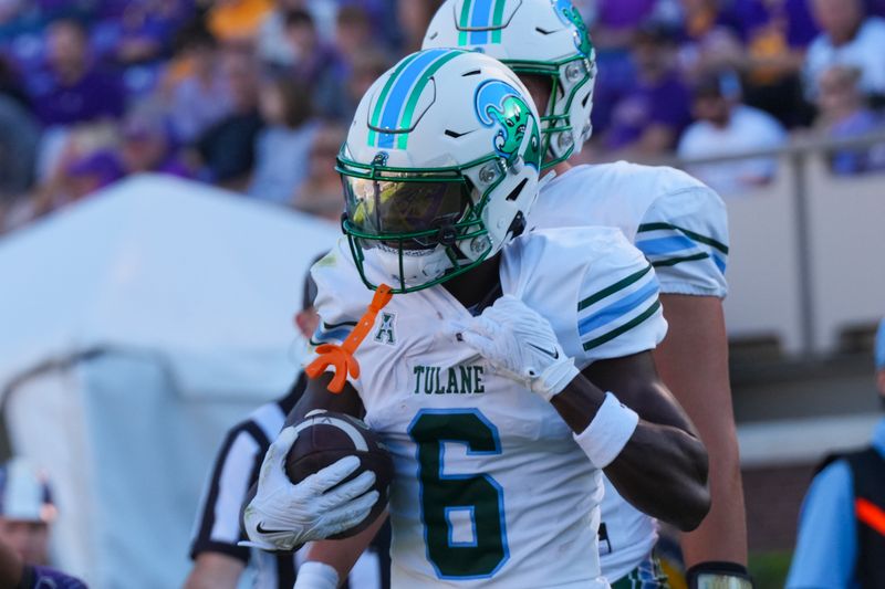 Nov 4, 2023; Greenville, North Carolina, USA;  Tulane Green Wave wide receiver Lawrence Keys III (6) celebrates his touchdown against the East Carolina Pirates during the first half at Dowdy-Ficklen Stadium. Mandatory Credit: James Guillory-USA TODAY Sports