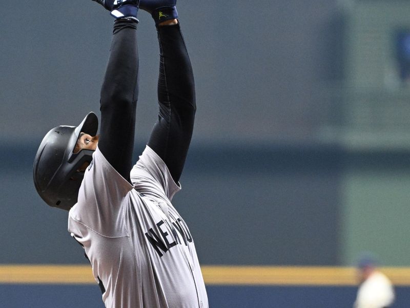 Apr 26, 2024; Milwaukee, Wisconsin, USA;  New York Yankees outfielder Juan Soto (22) rounds the bases after hitting a home run against the Milwaukee Brewers in the first inning at American Family Field. Mandatory Credit: Michael McLoone-USA TODAY Sports