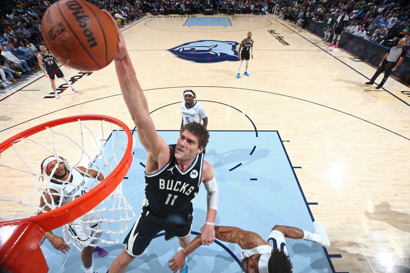 MEMPHIS, TN - FEBRUARY 15: Brook Lopez #11 of the Milwaukee Bucks dunks the ball during the game against the Memphis Grizzlies on February 15, 2024 at FedExForum in Memphis, Tennessee. NOTE TO USER: User expressly acknowledges and agrees that, by downloading and or using this photograph, User is consenting to the terms and conditions of the Getty Images License Agreement. Mandatory Copyright Notice: Copyright 2024 NBAE (Photo by Stephen Gosling/NBAE via Getty Images)