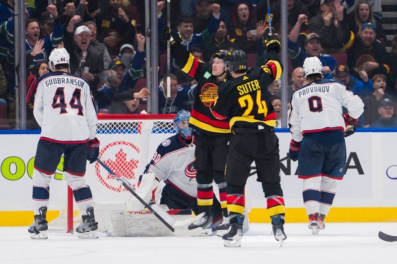 Jan 27, 2024; Vancouver, British Columbia, CAN; Columbus Blue Jackets defenseman Erik Gudbranson (44) and goalie Elvis Merzlikins (90) and defenseman Ivan Provorov (9) watch as Vancouver Canucks forward Brock Boeser (6) and forward Pius Suter (24) celebrate Boeser s second goal of the game in the third period at Rogers Arena. Canucks won 5-4 in overtime. Mandatory Credit: Bob Frid-USA TODAY Sports