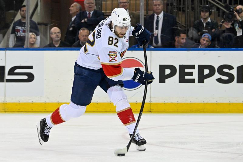 May 30, 2024; New York, New York, USA; Florida Panthers center Kevin Stenlund (82) shoots against the New York Rangers during the second period in game five of the Eastern Conference Final of the 2024 Stanley Cup Playoffs at Madison Square Garden. Mandatory Credit: Dennis Schneidler-USA TODAY Sports