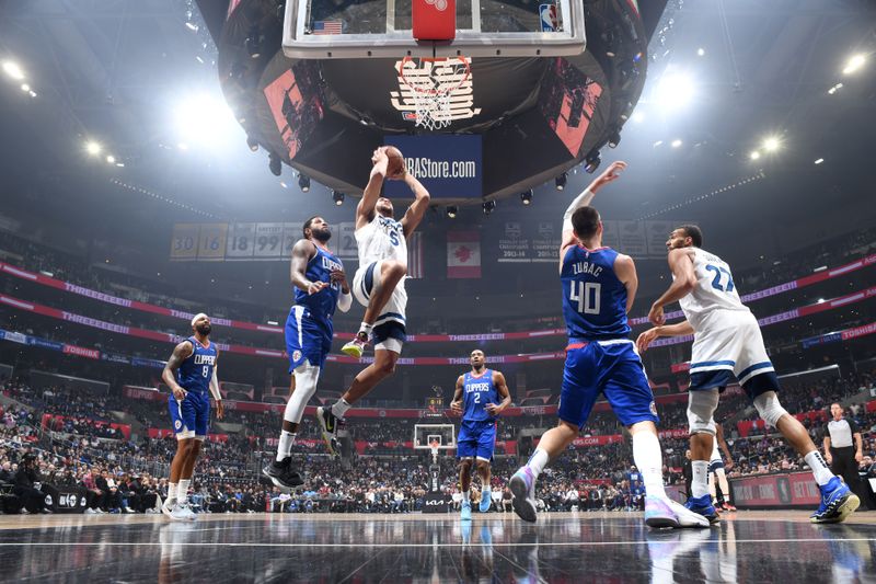 LOS ANGELES, CA - FEBRUARY 28: Kyle Anderson #5 of the Minnesota Timberwolves drives to the basket during the game against the LA Clippers on February 28, 2023 at Crypto.Com Arena in Los Angeles, California. NOTE TO USER: User expressly acknowledges and agrees that, by downloading and/or using this Photograph, user is consenting to the terms and conditions of the Getty Images License Agreement. Mandatory Copyright Notice: Copyright 2023 NBAE (Photo by Adam Pantozzi/NBAE via Getty Images)