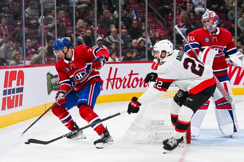 Oct 1, 2024; Montreal, Quebec, CAN; Montreal Canadiens defenseman Logan Mailloux (24) defends the puck against Ottawa Senators right wing Michael Amadio (22) behind the net during the third period at Bell Centre. Mandatory Credit: David Kirouac-Imagn Images