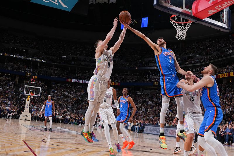 DENVER, CO - MAY 15: Chet Holmgren #7 of the Oklahoma City Thunder rebounds the ball during the game against the Denver Nuggets during Round 2 Game 6 on May 15, 2025 at Ball Arena in Denver, Colorado. NOTE TO USER: User expressly acknowledges and agrees that, by downloading and/or using this Photograph, user is consenting to the terms and conditions of the Getty Images License Agreement. Mandatory Copyright Notice: Copyright 2025 NBAE (Photo by Bart Young/NBAE via Getty Images)