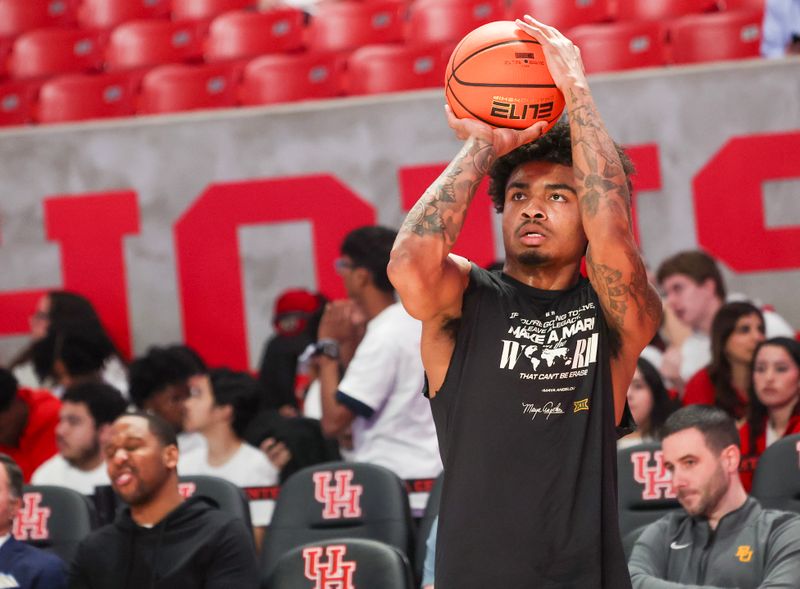 Feb 10, 2025; Houston, Texas, USA; Baylor Bears guard Langston Love (13) warms up before playing against the Houston Cougars at Fertitta Center. Mandatory Credit: Thomas Shea-Imagn Images