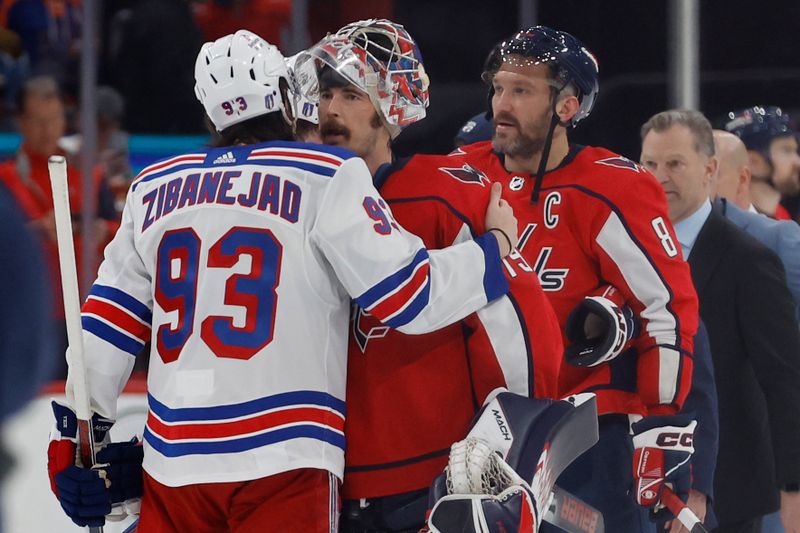 Apr 28, 2024; Washington, District of Columbia, USA; New York Rangers center Mika Zibanejad (93) hugs Washington Capitals goaltender Charlie Lindgren (79) in the handshake line after game four of the first round of the 2024 Stanley Cup Playoffs at Capital One Arena. Mandatory Credit: Geoff Burke-USA TODAY Sports