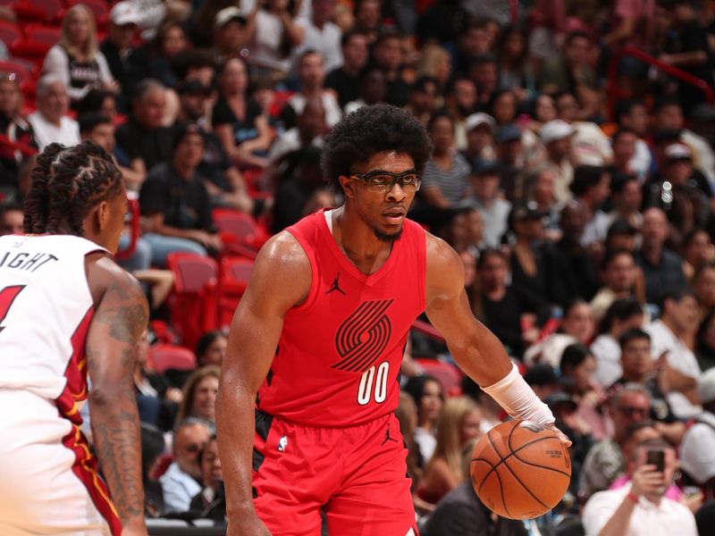 MIAMI, FL - MARCH 29: Scoot Henderson #00 of the Portland Trail Blazers dribbles the ball during the game against the Miami Heat on March 29, 2024 at Kaseya Center in Miami, Florida. NOTE TO USER: User expressly acknowledges and agrees that, by downloading and or using this Photograph, user is consenting to the terms and conditions of the Getty Images License Agreement. Mandatory Copyright Notice: Copyright 2024 NBAE (Photo by Issac Baldizon/NBAE via Getty Images)