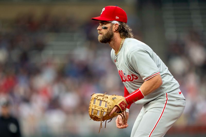 Jul 22, 2024; Minneapolis, Minnesota, USA; Philadelphia Phillies first baseman Bryce Harper (3) looks on against the Minnesota Twins in the first inning at Target Field. Mandatory Credit: Jesse Johnson-USA TODAY Sports