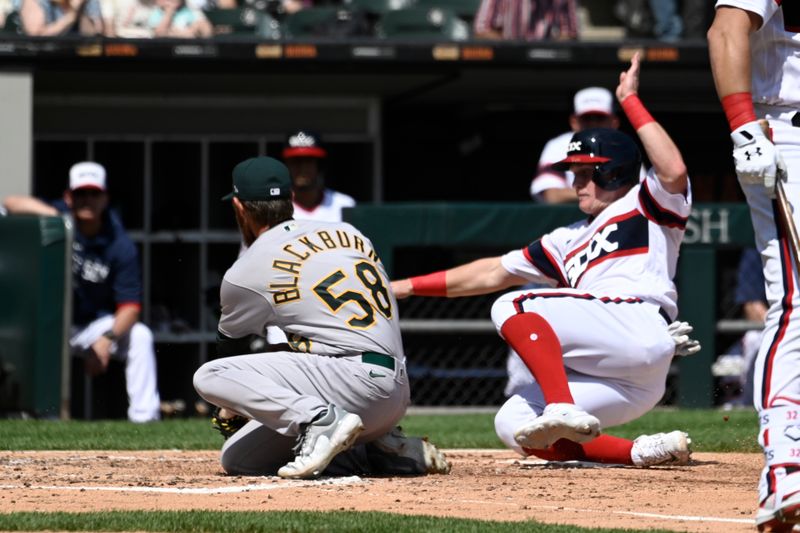 Aug 27, 2023; Chicago, Illinois, USA;  Chicago White Sox first baseman Andrew Vaughn (25) scores past Oakland Athletics starting pitcher Paul Blackburn (58) during the third inning at Guaranteed Rate Field. Mandatory Credit: Matt Marton-USA TODAY Sports