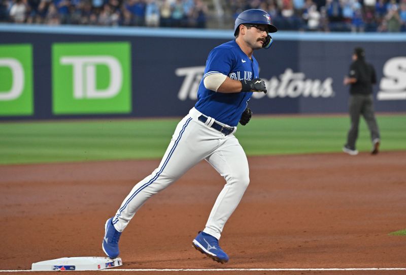 Aug 26, 2023; Toronto, Ontario, CAN;  Toronto Blue Jays second baseman Davis Schneider (36) rounds third base after hitting a two run home run against the Cleveland Guardians in the first inning at Rogers Centre. Mandatory Credit: Dan Hamilton-USA TODAY Sports