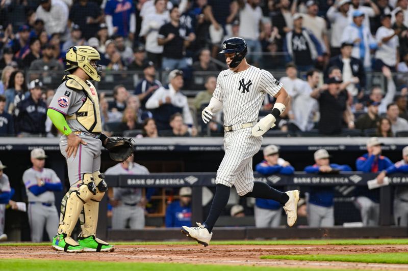 May 16, 2025; Bronx, New York, USA; New York Yankees outfielder Aaron Judge (99) scores on a RBI single by first baseman Paul Goldschmidt (not pictured) during the third inning against the New York Mets at Yankee Stadium. Mandatory Credit: John Jones-Imagn Images