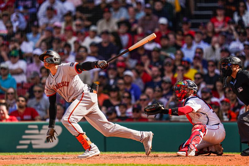 May 2, 2024; Boston, Massachusetts, USA; San Francisco Giants shortstop Nick Ahmed (16) hits a sacrifice fly to drive in a run against the Boston Red Sox in the seventh inning at Fenway Park. Mandatory Credit: David Butler II-USA TODAY Sports