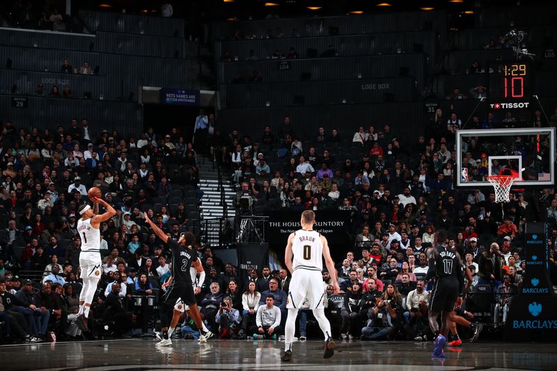 BROOKLYN, NY - OCTOBER 29: Michael Porter Jr. #1 of the Denver Nuggets shoots a three point basket during the game against the Brooklyn Nets on October 29, 2024 at Barclays Center in Brooklyn, New York. NOTE TO USER: User expressly acknowledges and agrees that, by downloading and or using this Photograph, user is consenting to the terms and conditions of the Getty Images License Agreement. Mandatory Copyright Notice: Copyright 2024 NBAE (Photo by David L. Nemec/NBAE via Getty Images)