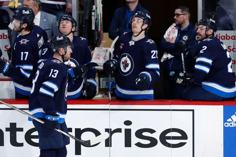 Apr 4, 2024; Winnipeg, Manitoba, CAN; Winnipeg Jets center Gabriel Vilardi (13) celebrates his third period goal against the Calgary Flames at Canada Life Centre. Mandatory Credit: James Carey Lauder-USA TODAY Sports