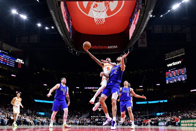 ATLANTA, GA - JANUARY 26: Dejounte Murray #5 of the Atlanta Hawks drives to the basket during the game against the Dallas Mavericks on January 26, 2024 at State Farm Arena in Atlanta, Georgia.  NOTE TO USER: User expressly acknowledges and agrees that, by downloading and/or using this Photograph, user is consenting to the terms and conditions of the Getty Images License Agreement. Mandatory Copyright Notice: Copyright 2024 NBAE (Photo by Adam Hagy/NBAE via Getty Images)