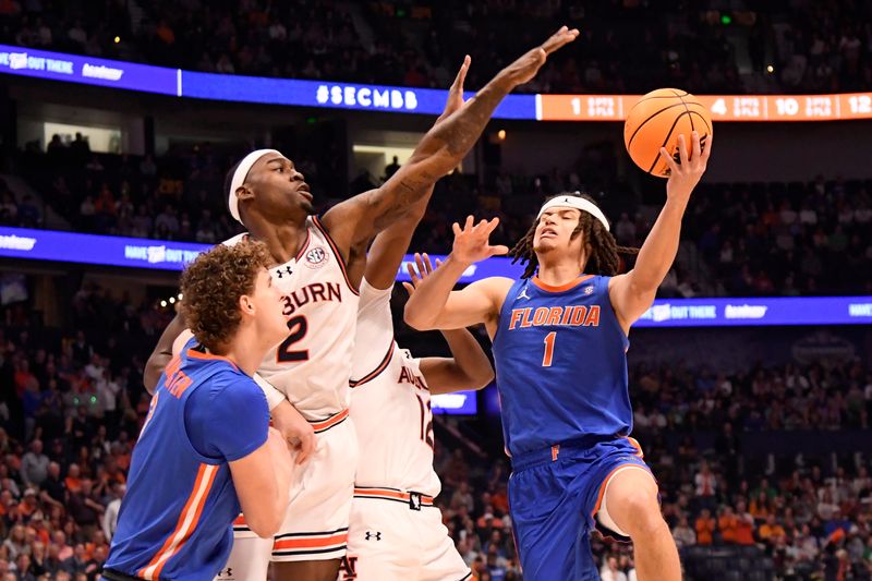 Mar 17, 2024; Nashville, TN, USA; Florida Gators guard Walter Clayton Jr. (1) shoots against Auburn Tigers forward Jaylin Williams (2) in the first half at Bridgestone Arena. Mandatory Credit: Steve Roberts-USA TODAY Sports