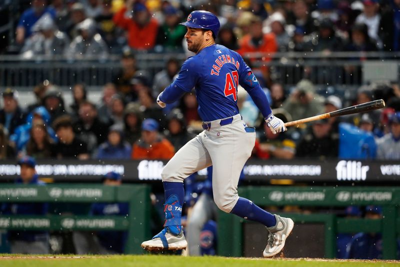 May 11, 2024; Pittsburgh, Pennsylvania, USA;  Chicago Cubs designated hitter Mike Tauchman (40) hits an infield RBI single against the Pittsburgh Pirates during the fifth inning at PNC Park. Mandatory Credit: Charles LeClaire-USA TODAY Sports