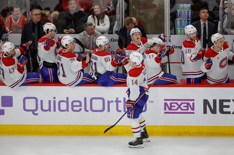 Dec 22, 2023; Chicago, Illinois, USA; Montreal Canadiens center Nick Suzuki (14) celebrates with teammates after scoring against the Chicago Blackhawks during the third period at United Center. Mandatory Credit: Kamil Krzaczynski-USA TODAY Sports