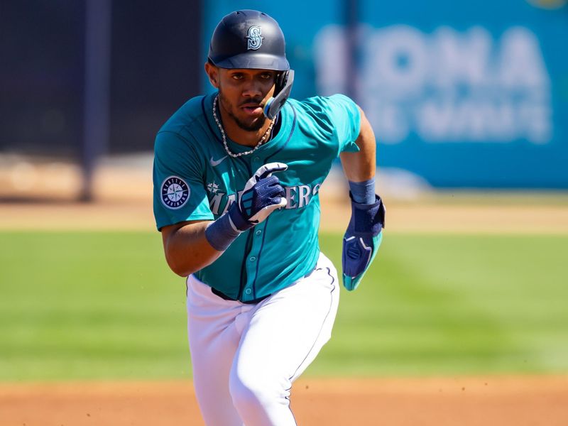 Mar 5, 2024; Peoria, Arizona, USA; Seattle Mariners outfielder Julio Rodriguez against the Texas Rangers during a spring training baseball game at Peoria Sports Complex. Mandatory Credit: Mark J. Rebilas-USA TODAY Sports