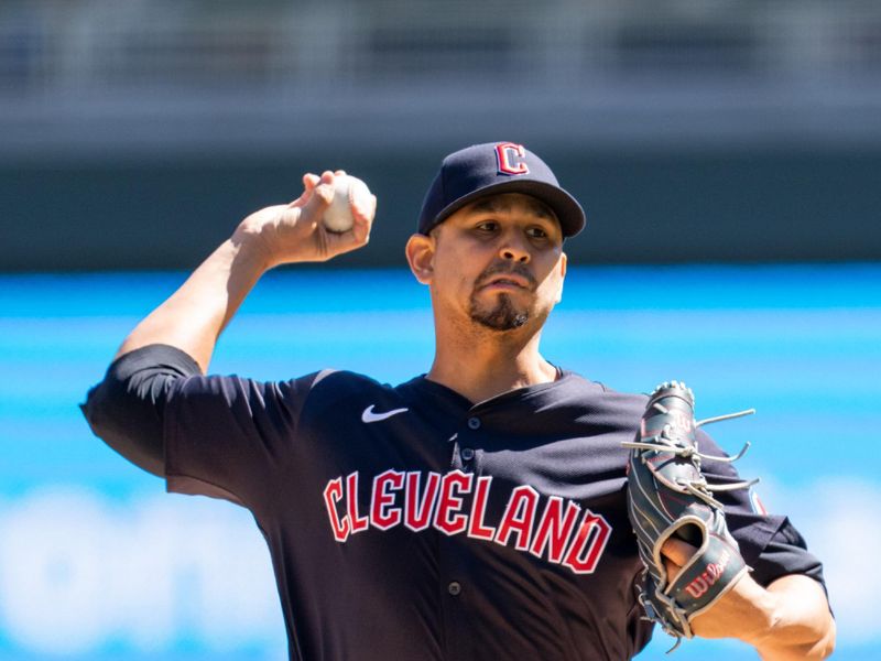 Apr 6, 2024; Minneapolis, Minnesota, USA; Cleveland Guardians starting pitcher Carlos Carrasco (59) pitches against the Minnesota Twins in the first inning at Target Field. Mandatory Credit: Matt Blewett-USA TODAY Sports