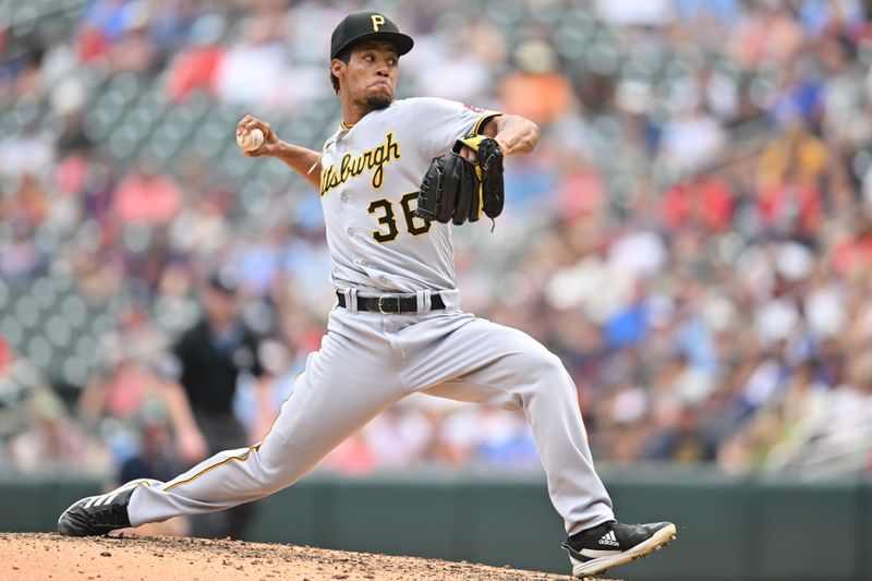 Aug 20, 2023; Minneapolis, Minnesota, USA; Pittsburgh Pirates relief pitcher Dauri Moreta (36) throws a pitch against the Minnesota Twins during the eighth inning at Target Field. Mandatory Credit: Jeffrey Becker-USA TODAY Sports