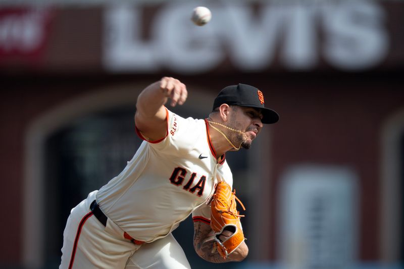 Sep 10, 2025; San Francisco, California, USA; San Francisco Giants pitcher José Buttó (70) delivers a pitch against the Arizona Diamondbacks during the ninth inning at Oracle Park. Mandatory Credit: D. Ross Cameron-Imagn Images
