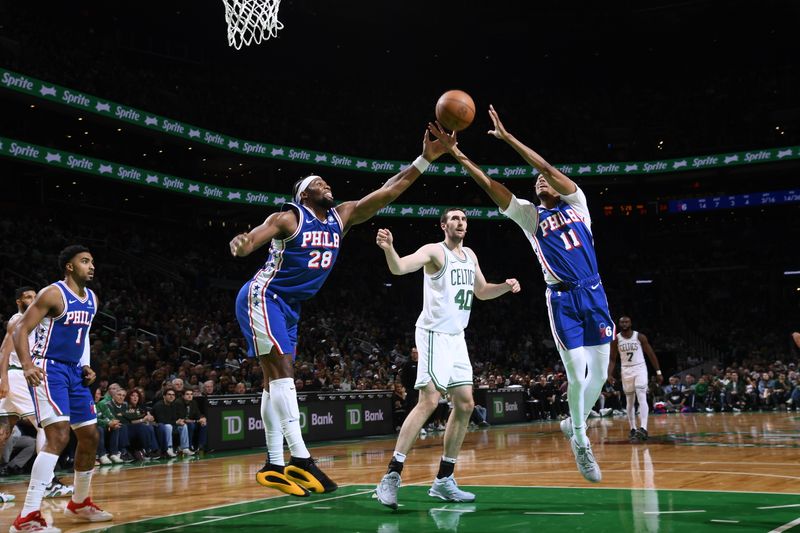 BOSTON, MA - OCTOBER 12: Guerschon Yabusele #28 and Jeff Dowtin Jr. #11 of the Philadelphia 76ers go up for the rebound during the game against the Boston Celtics during a NBA Preseason game on October 12, 2024 at TD Garden in Boston, Massachusetts. NOTE TO USER: User expressly acknowledges and agrees that, by downloading and/or using this Photograph, user is consenting to the terms and conditions of the Getty Images License Agreement. Mandatory Copyright Notice: Copyright 2024 NBAE (Photo by Brian Babineau/NBAE via Getty Images)