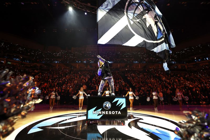 MINNEAPOLIS, MN - NOVEMBER 17: Mascot Crunch the Wolf of the Minnesota Timberwolves waves flag before the game against the Phoenix Suns on November 17, 2024 at Target Center in Minneapolis, Minnesota. NOTE TO USER: User expressly acknowledges and agrees that, by downloading and or using this Photograph, user is consenting to the terms and conditions of the Getty Images License Agreement. Mandatory Copyright Notice: Copyright 2024 NBAE(Photo by David Sherman/NBAE via Getty Images)