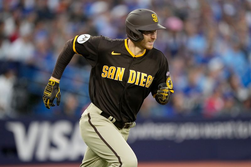 Jul 19, 2023; Toronto, Ontario, CAN; San Diego Padres right fielder Taylor Kohlwey (38) runs out a fly ball against the Toronto Blue Jays during the fifth inning at Rogers Centre in his first MLB game. Mandatory Credit: John E. Sokolowski-USA TODAY Sports