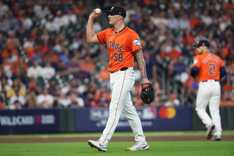 Oct 2, 2024; Houston, Texas, USA; Houston Astros pitcher Hunter Brown (58) asks for a new ball before throwing against the Detroit Tigers during the first inning of game two of the Wildcard round for the 2024 MLB Playoffs at Minute Maid Park. Mandatory Credit: Thomas Shea-Imagn Images