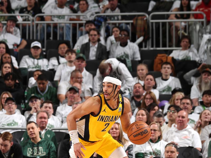 MILWAUKEE, WI - APRIL 23: Andrew Nembhard #2 of the Indiana Pacers handles the ball during the game against the Milwaukee Bucks during Round One Game Two of the 2024 NBA Playoffs on April 23, 2024 at the Fiserv Forum Center in Milwaukee, Wisconsin. NOTE TO USER: User expressly acknowledges and agrees that, by downloading and or using this Photograph, user is consenting to the terms and conditions of the Getty Images License Agreement. Mandatory Copyright Notice: Copyright 2024 NBAE (Photo by Gary Dineen/NBAE via Getty Images).