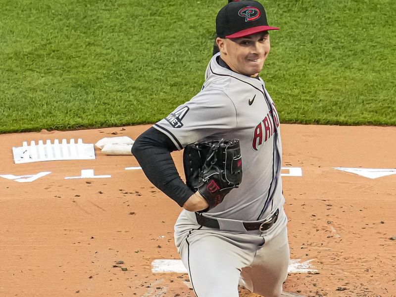 Apr 5, 2024; Cumberland, Georgia, USA; Arizona Diamondbacks starting pitcher Tommy Henry (47) pitches against the Atlanta Braves during the first inning at Truist Park. Mandatory Credit: Dale Zanine-USA TODAY Sports