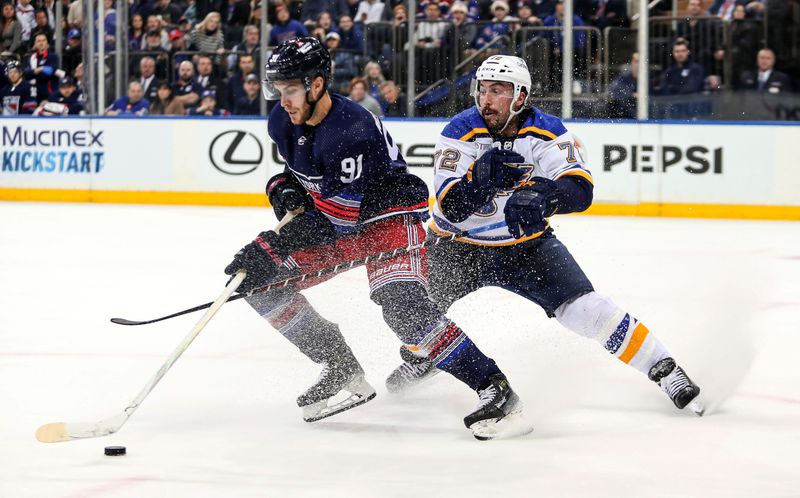 Mar 9, 2024; New York, New York, USA; New York Rangers center Alex Wennberg (91) skates in with the puck against St. Louis Blues defenseman Justin Faulk (72) who was called for hooking during the second period at Madison Square Garden. Mandatory Credit: Danny Wild-USA TODAY Sports