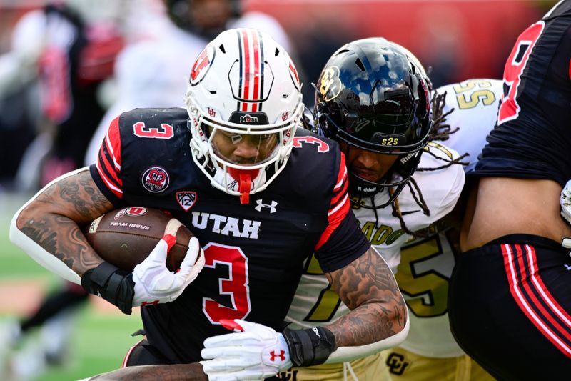 Nov 25, 2023; Salt Lake City, Utah, USA; Utah Utes running back Ja'Quinden Jackson (3) gets tackled by Colorado Buffaloes safety Cam'Ron Silmon-Craig (7) at Rice-Eccles Stadium. Mandatory Credit: Christopher Creveling-USA TODAY Sports