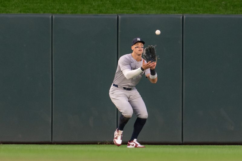 May 15, 2024; Minneapolis, Minnesota, USA; New York Yankees center fielder Aaron Judge (99) catches Minnesota Twins left fielder Alex Kirilloff (19) out in the fourth inning at Target Field. Mandatory Credit: Matt Blewett-USA TODAY Sports