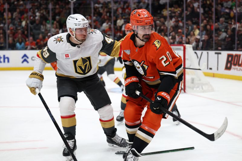 Feb 1, 2026; Anaheim, California, USA;  Anaheim Ducks left wing Chris Kreider (20) fights for the puck against Vegas Golden Knights left wing Ivan Barbashev (49) during the second period at Honda Center. Mandatory Credit: Kiyoshi Mio-Imagn Images