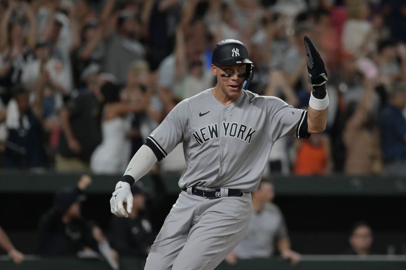 Jul 29, 2023; Baltimore, Maryland, USA; New York Yankees right fielder Aaron Judge (99) reacts while waving team mates home during the sixth inning against the New York Yankees  at Oriole Park at Camden Yards. Mandatory Credit: Tommy Gilligan-USA TODAY Sports