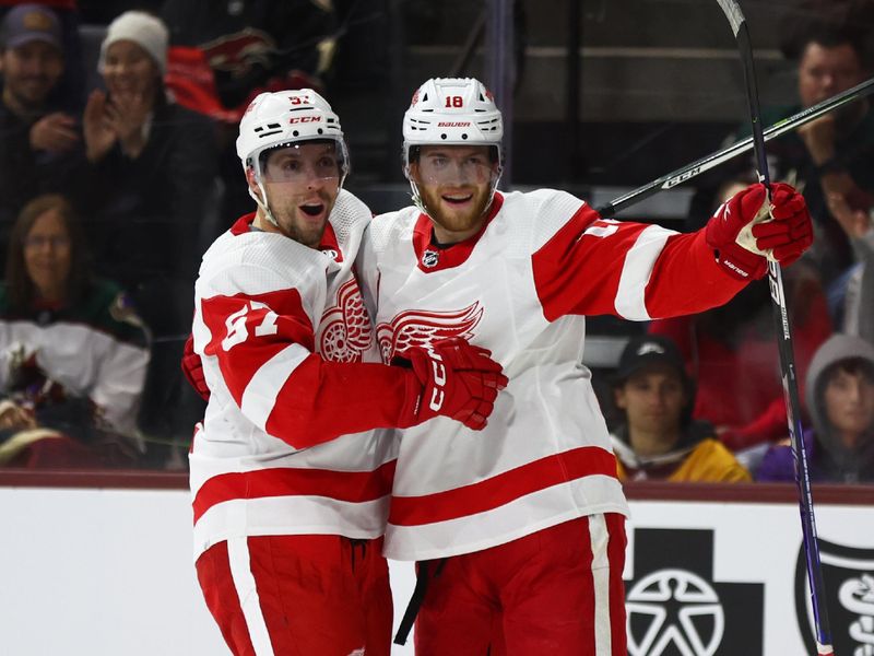 Jan 17, 2023; Tempe, Arizona, USA; Detroit Red Wings left wing David Perron (57) celebrates a goal with center Andrew Copp (18) against the Arizona Coyotes in the third period at Mullett Arena. Mandatory Credit: Mark J. Rebilas-USA TODAY Sports