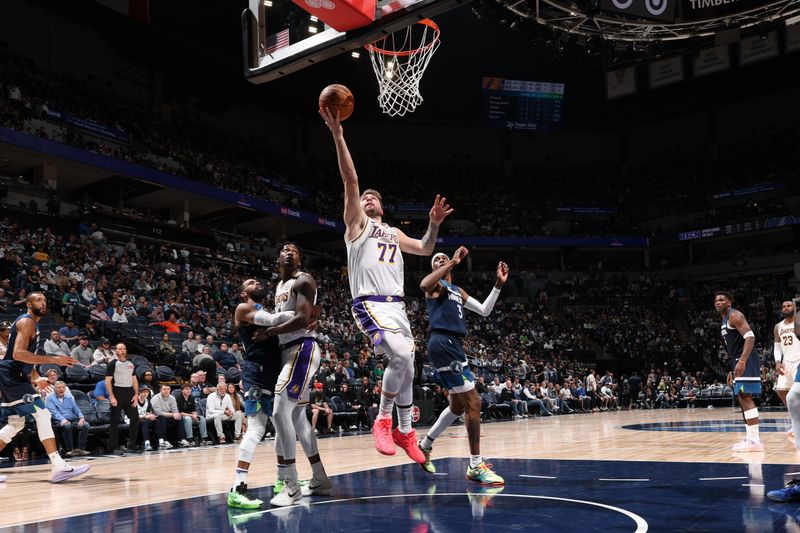 MINNEAPOLIS, MN -  APRIL  27: Luka Doncic #77 of the Los Angeles Lakers drives to the basket during the game against the Minnesota Timberwolves  during Round 1 Game 4 of the 2025 NBA Playoffs  on April 27, 2025 at Target Center in Minneapolis, Minnesota. NOTE TO USER: User expressly acknowledges and agrees that, by downloading and or using this Photograph, user is consenting to the terms and conditions of the Getty Images License Agreement. Mandatory Copyright Notice: Copyright 2025 NBAE (Photo by David Sherman/NBAE via Getty Images)