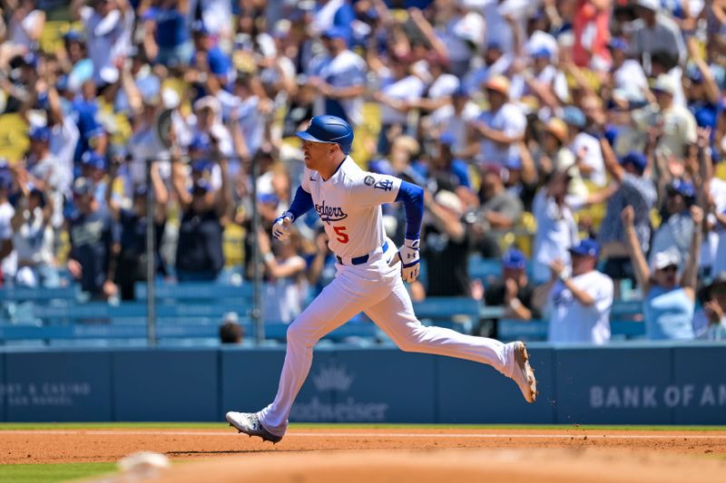 Aug 31, 2025; Los Angeles, California, USA; Los Angeles Dodgers first baseman Freddie Freeman (5) doubles during the first inning at Dodger Stadium. Mandatory Credit: Jayne Kamin-Oncea-Imagn Images