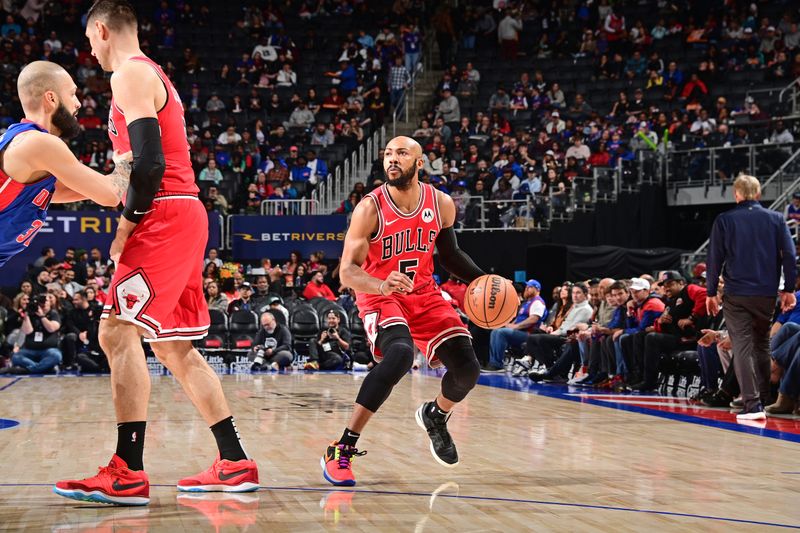 DETROIT, MI - APRIL 11: Jevon Carter #5 of the Chicago Bulls dribbles the ball during the game against the Detroit Pistons on April 11, 2024 at Little Caesars Arena in Detroit, Michigan. NOTE TO USER: User expressly acknowledges and agrees that, by downloading and/or using this photograph, User is consenting to the terms and conditions of the Getty Images License Agreement. Mandatory Copyright Notice: Copyright 2024 NBAE (Photo by Chris Schwegler/NBAE via Getty Images)