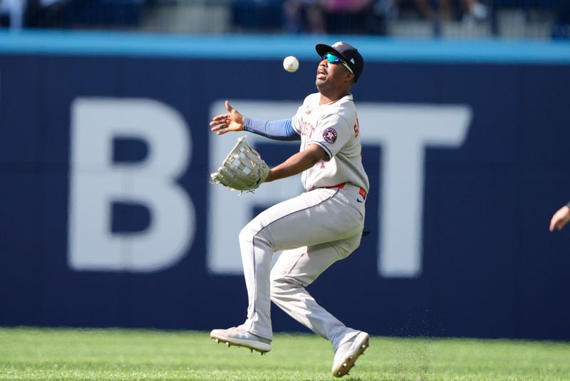 Sep 11, 2025; Toronto, Ontario, CAN; Houston Astros right fielder Jesus Sanchez (4) misses a fly ball hit by Toronto Blue Jays third baseman Addison Barger (not pictured)  during the first inning at Rogers Centre. Mandatory Credit: John E. Sokolowski-Imagn Images