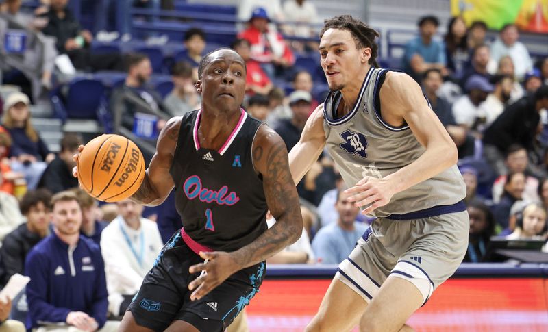 Jan 24, 2024; Houston, Texas, USA; Florida Atlantic Owls guard Johnell Davis (1) drives with the ball as Rice Owls forward Keanu Dawes (24) defends during the first half at Tudor Fieldhouse. Mandatory Credit: Troy Taormina-USA TODAY Sports