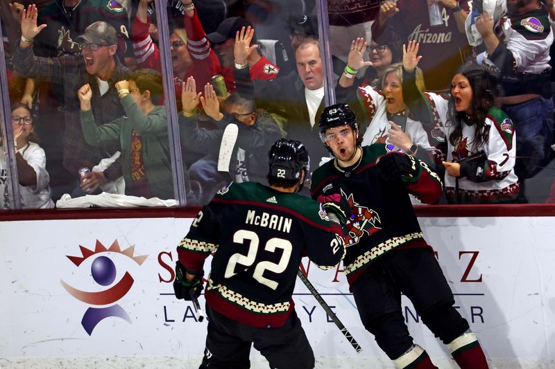 Apr 17, 2024; Tempe, Arizona, USA;  Arizona Coyotes left wing Matias Maccelli (63) celebrates scoring a goal during the second period of the game against the Edmonton Oilers at Mullett Arena. Mandatory Credit: Mark J. Rebilas-USA TODAY Sports