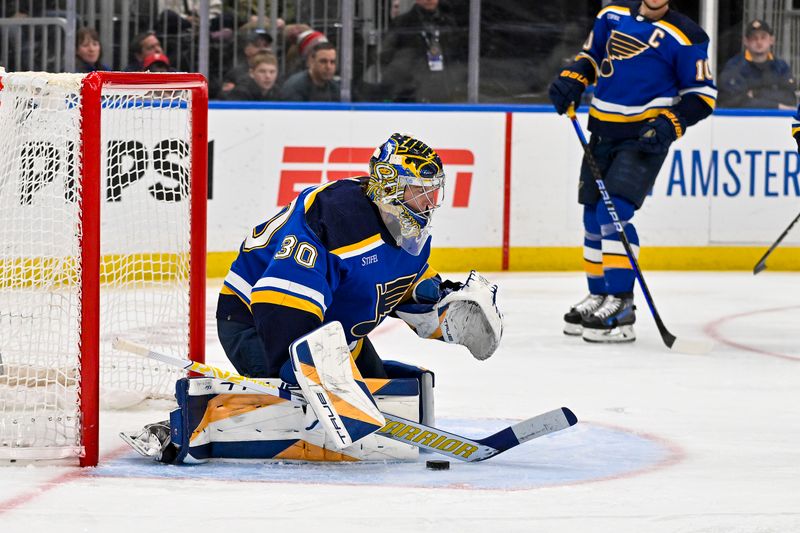 Feb 19, 2024; St. Louis, Missouri, USA;  St. Louis Blues goaltender Joel Hofer (30) defends the net against the Toronto Maple Leafs during the third period at Enterprise Center. Mandatory Credit: Jeff Curry-USA TODAY Sports