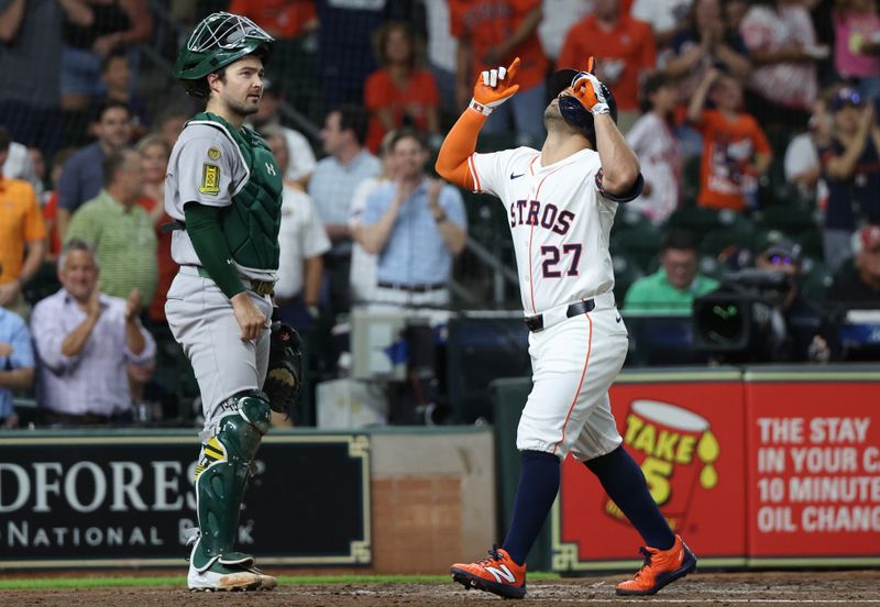 May 27, 2025; Houston, Texas, USA; Houston Astros designated hitter Jose Altuve (27) reacts to his home run against the Athletics in the third inning at Daikin Park. Mandatory Credit: Thomas Shea-Imagn Images