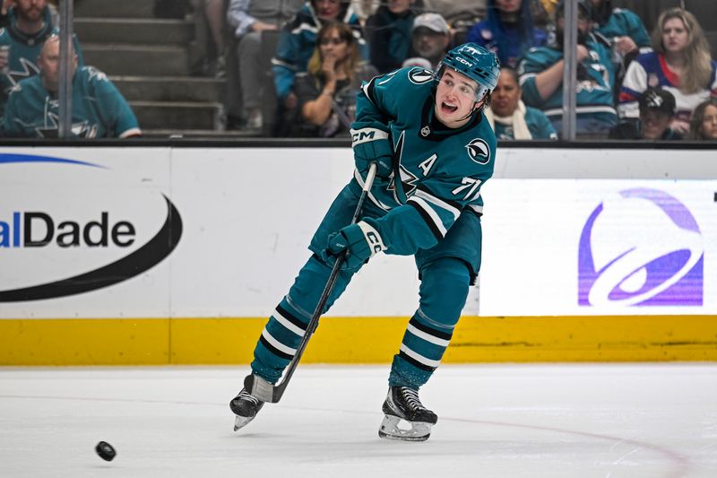Dec 20, 2025; San Jose, California, USA; San Jose Sharks center Macklin Celebrini (71) takes a shot on goal against against the Seattle Kraken during the second period at SAP Center at San Jose. Mandatory Credit: Justine Willard-Imagn Images