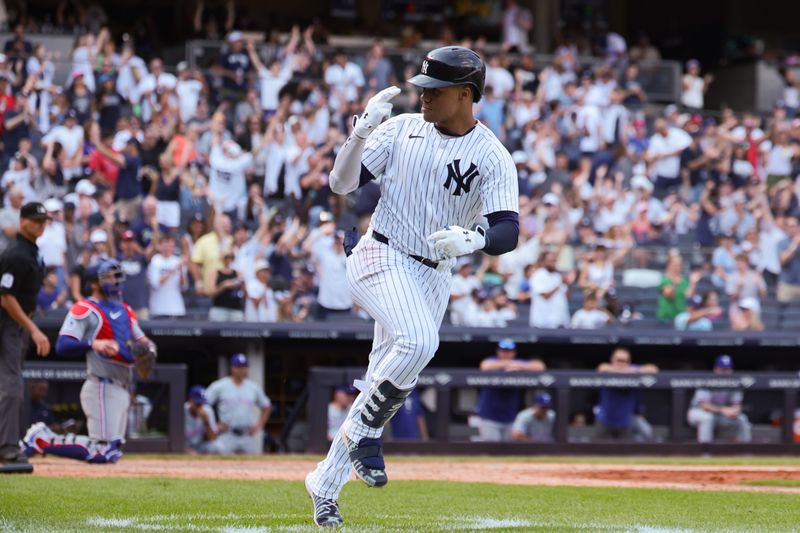 Aug 11, 2024; Bronx, New York, USA; New York Yankees right fielder Juan Soto (22) hits a solo home run during the seventh inning against the Texas Rangers at Yankee Stadium. Mandatory Credit: Vincent Carchietta-USA TODAY Sports