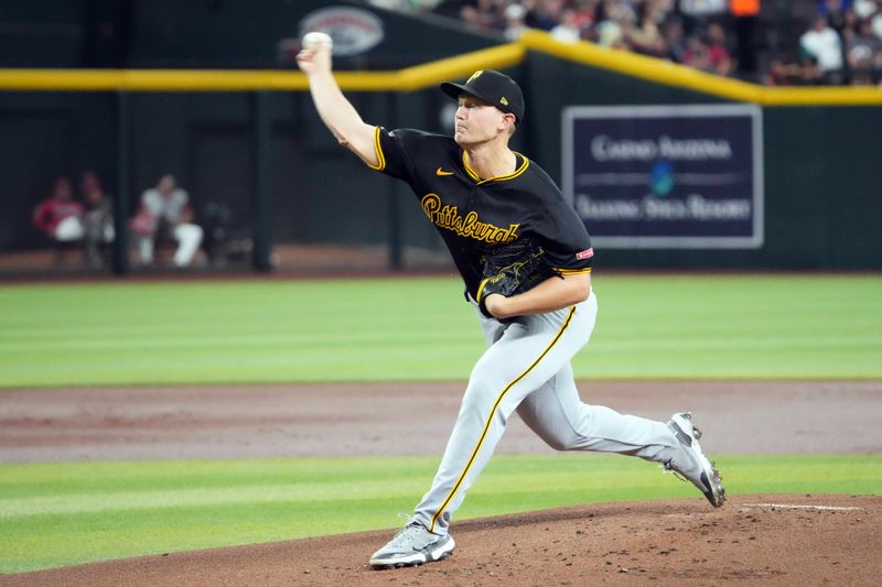 Jul 28, 2024; Phoenix, Arizona, USA; Pittsburgh Pirates pitcher Mitch Keller (23) pitches against the Arizona Diamondbacks during the first inning at Chase Field. Mandatory Credit: Joe Camporeale-USA TODAY Sports