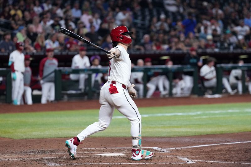 Jun 13, 2024; Phoenix, Arizona, USA; Arizona Diamondbacks outfielder Corbin Carroll (7) bats against the Los Angeles Angels during the fifth inning at Chase Field. Mandatory Credit: Joe Camporeale-USA TODAY Sports